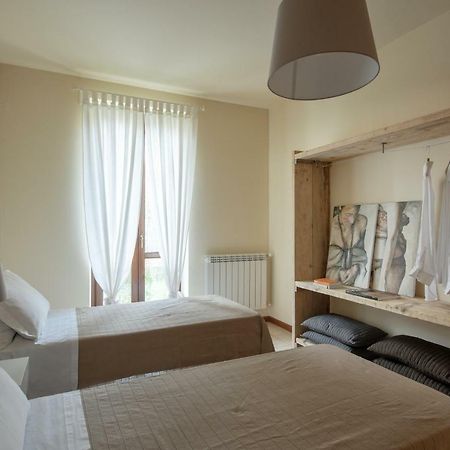 Appartamenti Corte Dei Cipressi Roe Bagian luar foto