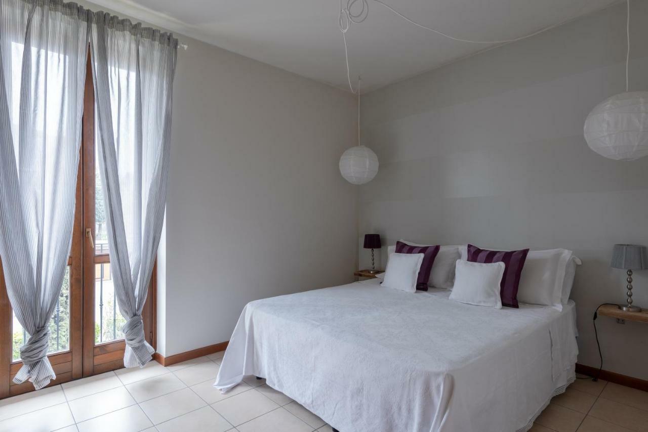 Appartamenti Corte Dei Cipressi Roe Bagian luar foto
