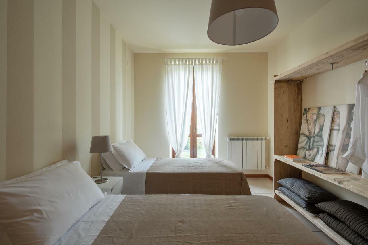Appartamenti Corte Dei Cipressi Roe Bagian luar foto