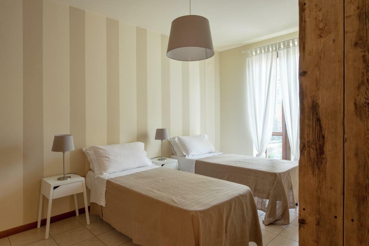 Appartamenti Corte Dei Cipressi Roe Bagian luar foto